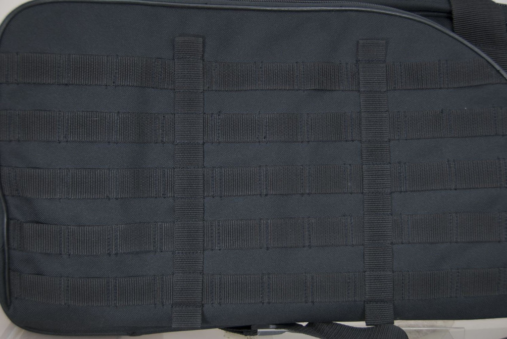 Close up of MOLLE webbing on front of Scoped Carbine Case in black.