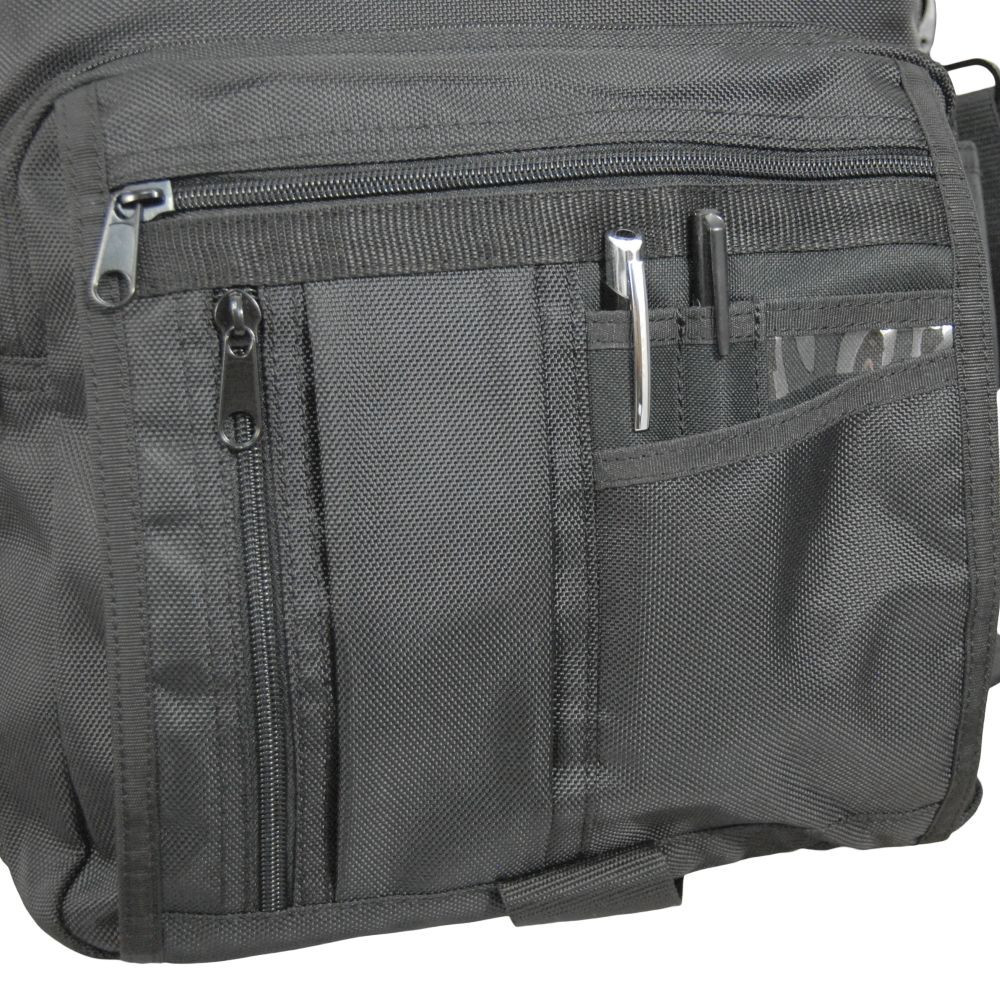 Front section on Business Backpack has 2 small zippered pockets, several slip-in pockets, & a large zippered pocket for a small notepad, electronics, power cords, etc.