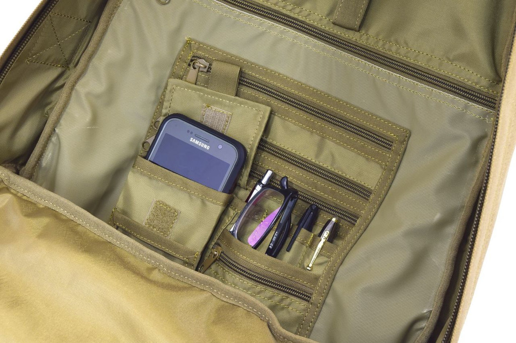 Interior organizer panel with multiple pockets for smaller items and pen slots, close up shown on the Pecos Tactical Backpack in coyote brown.
