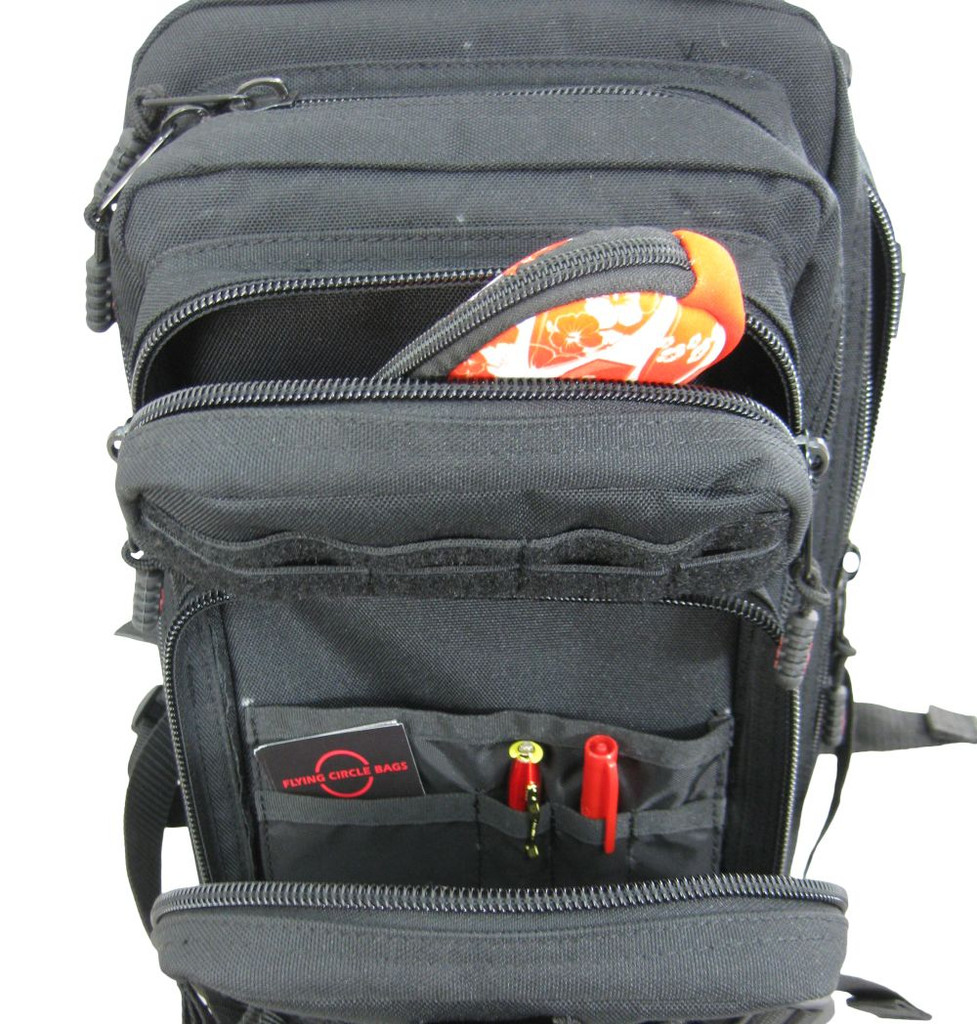 Presidio Tactical Assault Pack in black medium & small front pockets with MOLLE webbing opened with contents.