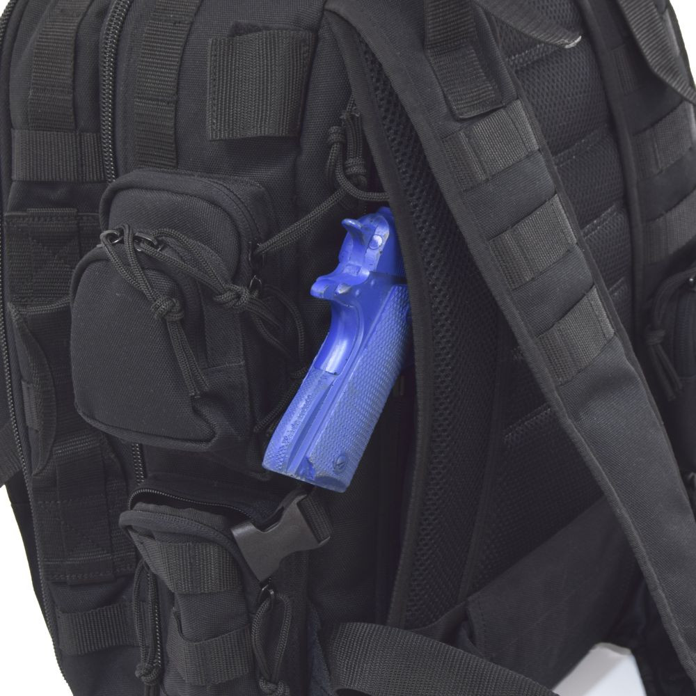 Hidden “pass through” backside pocket with zippers on both sides can be used as a secure conceal carry compartment.  Shown with blue gun inside Brazos Concealed Carry Backpack in black.
