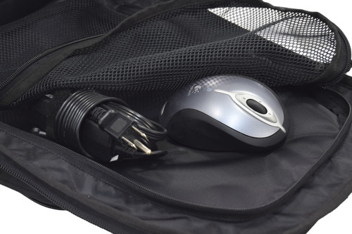 Mesh pocket inside Brazos Concealed Carry Backpack in black, shown with keyboard mouse and electrical cord.