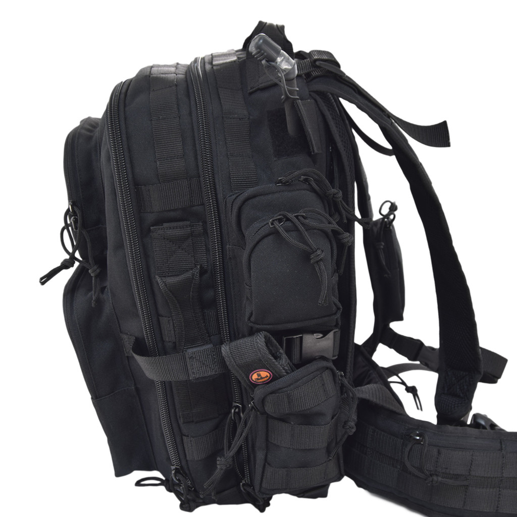 Brazos Concealed Carry Backpack in black with side pockets, MOLLE webbing and compression straps on side, shown with contents in side pocket and hydration reservoir tubing.