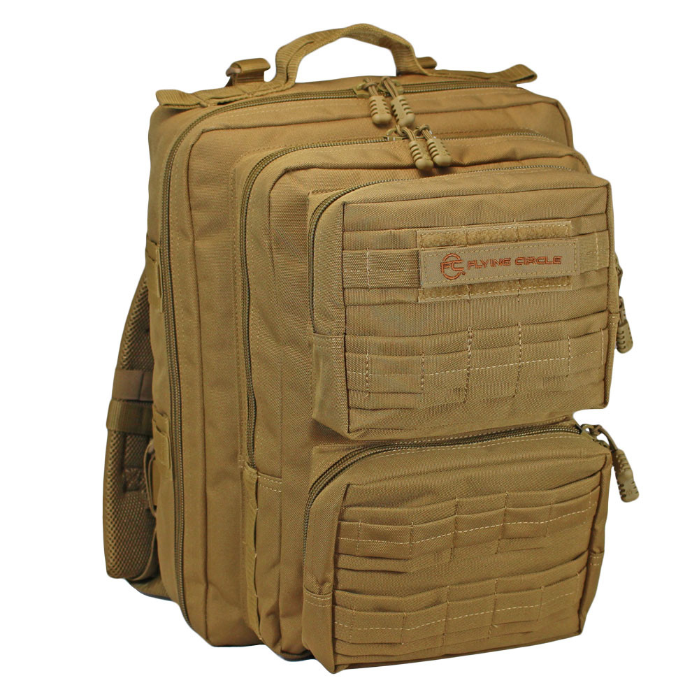 Front of Midland Military Backpack in coyote brown with two small pockets, MOLLE webbing wrapped in fabric, Flying Circle patch on top pocket, and top grab handle.