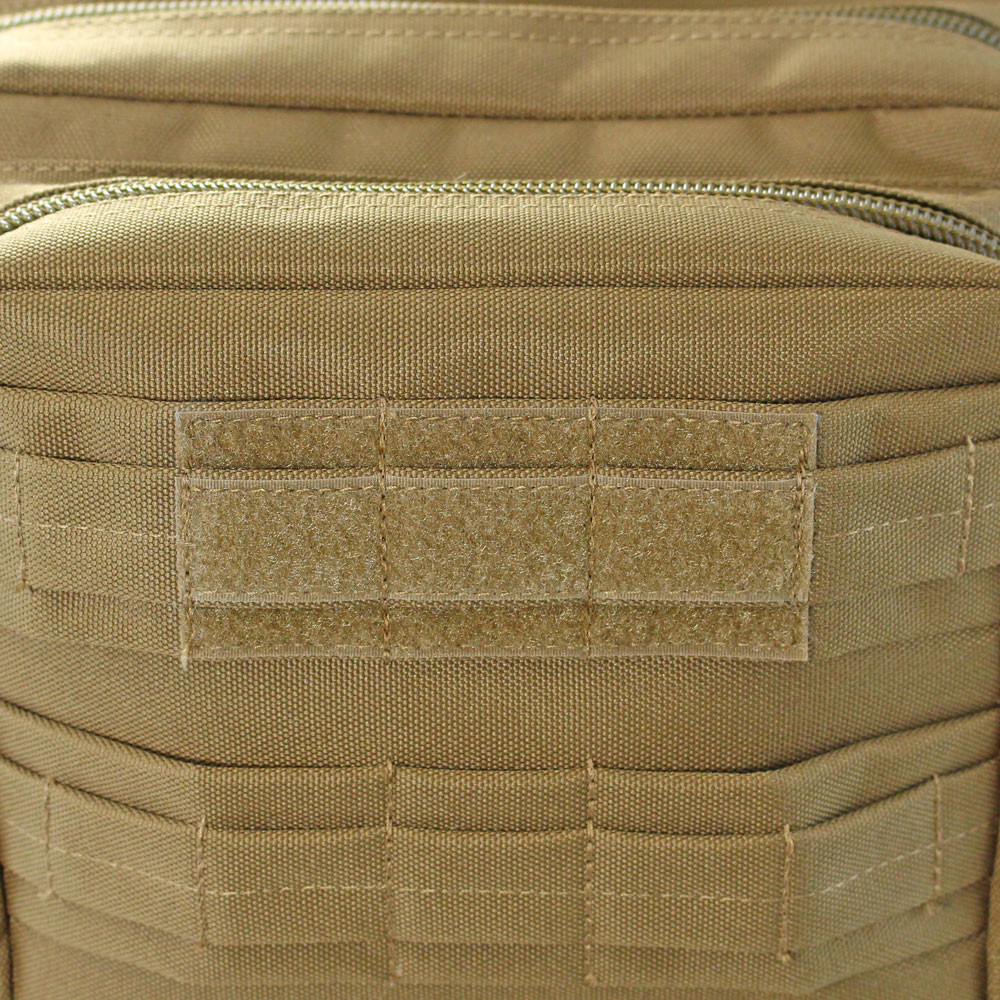 Loop backing on top front pocket for name tape on coyote brown Midland Backpack.