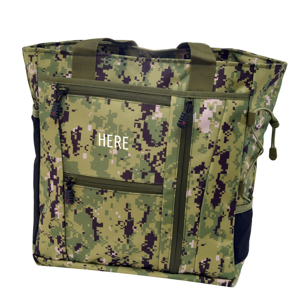 Monogram placement shown on top front pocket on Deluxe Travel Tote in NWU.