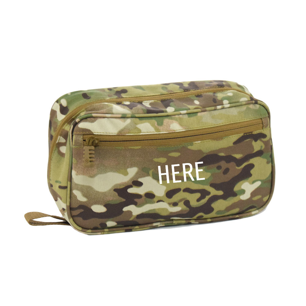 Concho Hanging Toiletry Bag in MultiCam® shown closed with zippered pocket on front and monogram placement on center of bag.