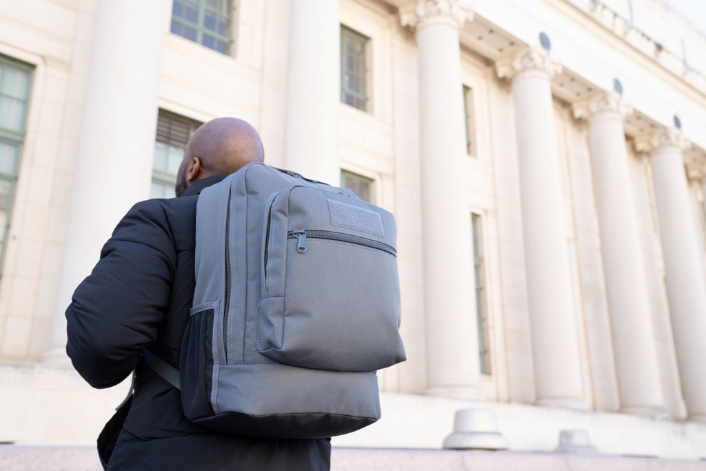 Utility Backpack in gun metal gray with side water bottle holder.