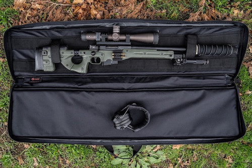 Black Single Rifle Case shown outdoors opened with firearm secured inside.