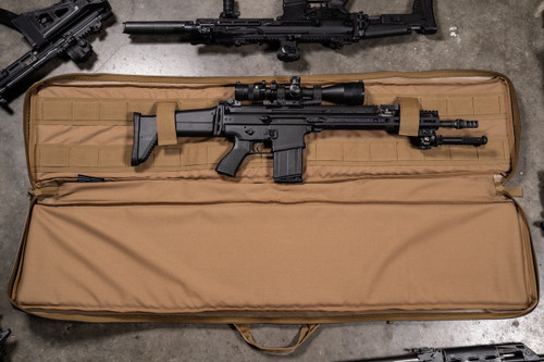 Coyote brown Single Rifle Case shown indoors opened with firearm secured inside.